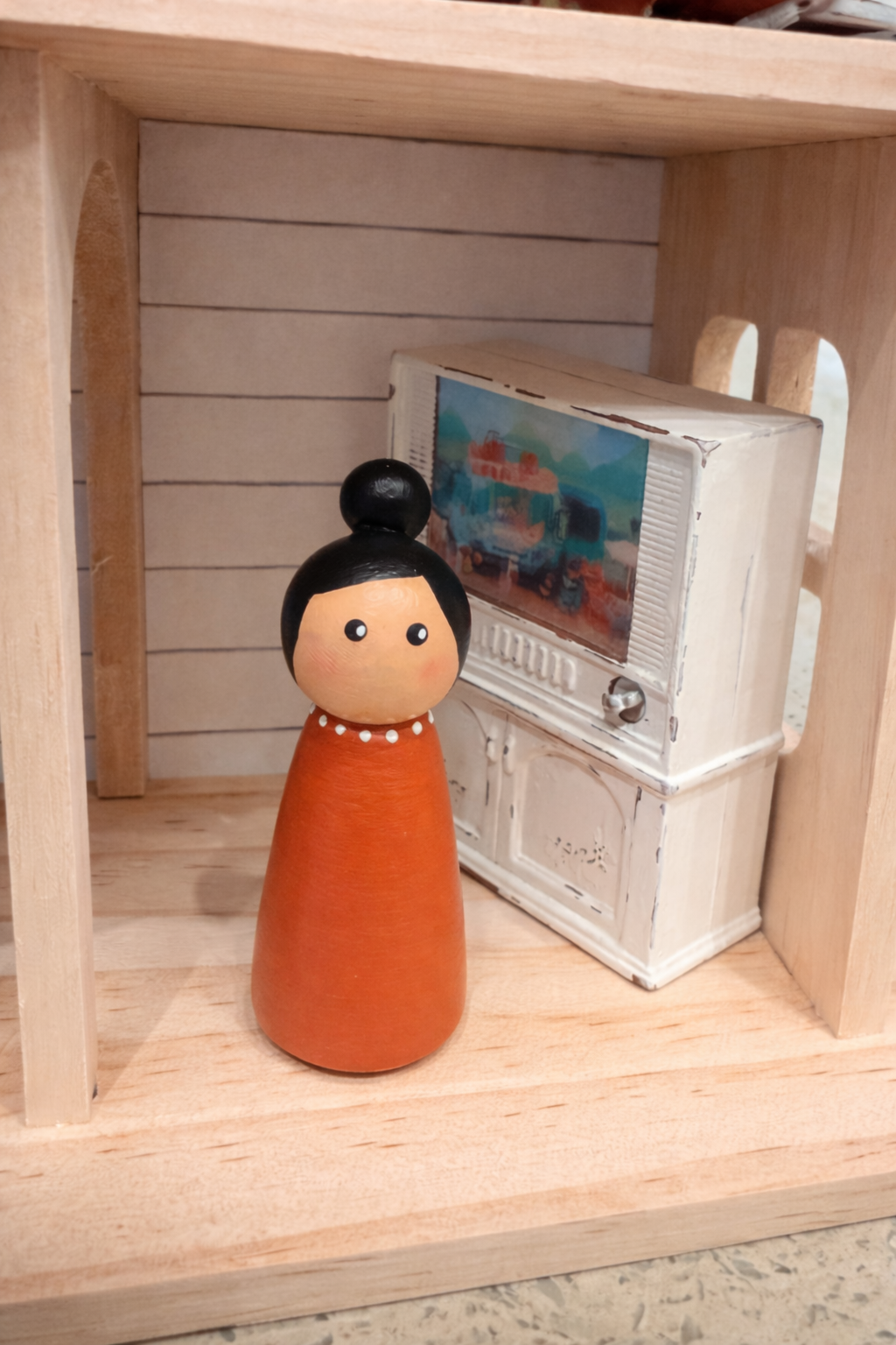 Floral cottage wooden dollhouse with peg dolls